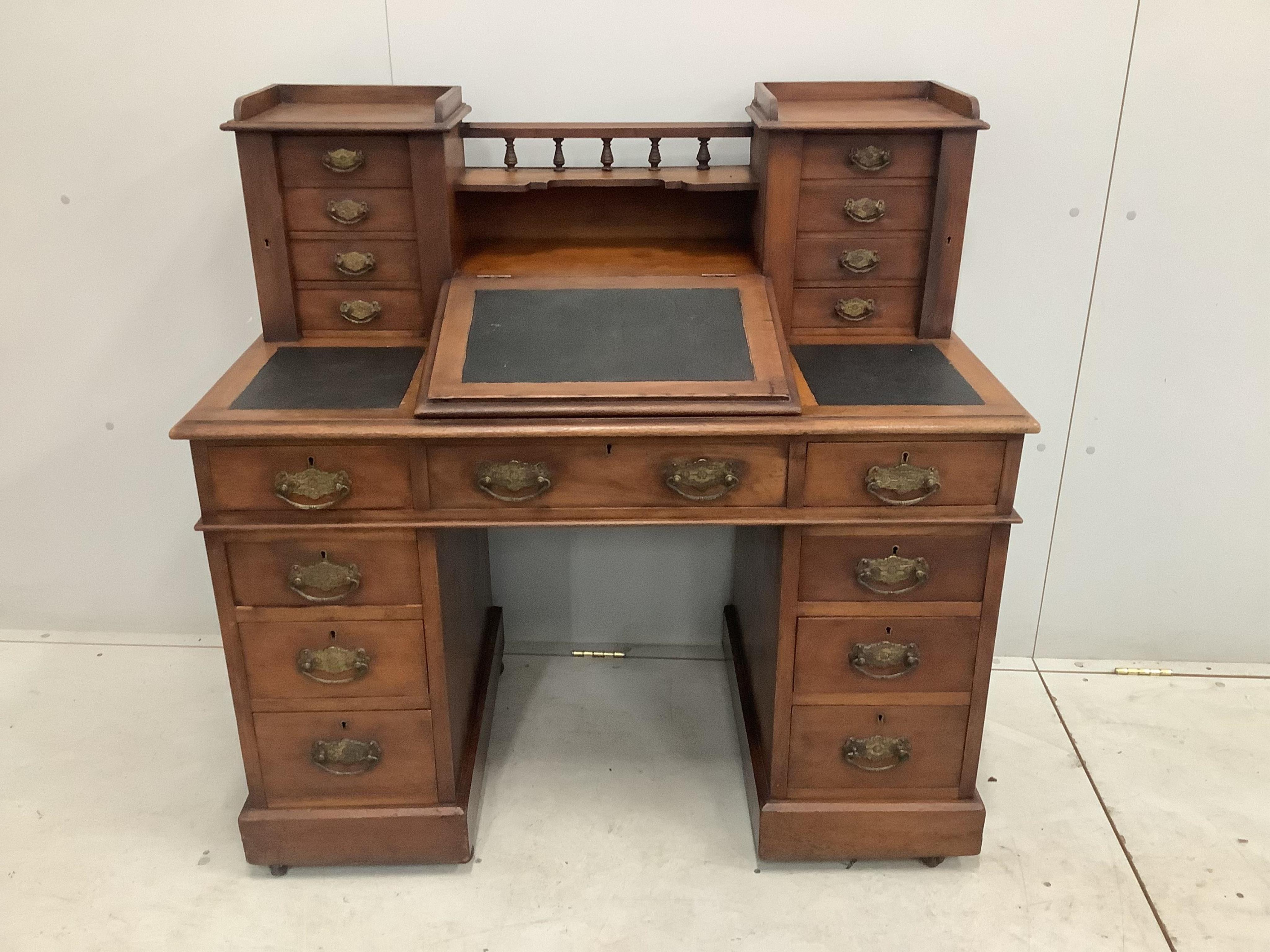 A late Victorian mahogany pedestal desk with raised superstructure, width 111cm, height 111cm. Condition - fair